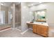 Detailed primary bathroom with a walk-in shower, double vanity, and tile flooring at 6941 Augustine Way, Charlotte, NC 28270