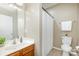 Cozy bathroom with tile floors, a wood vanity, and a shower/tub combination at 6941 Augustine Way, Charlotte, NC 28270