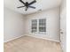 Cozy bedroom with carpet flooring, neutral walls, and a window providing natural light at 6941 Augustine Way, Charlotte, NC 28270
