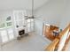 Open concept living room with a fireplace, ceiling fan, and view to the kitchen at 6941 Augustine Way, Charlotte, NC 28270