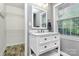 This bathroom features a sink with drawers and a large mirror at 7020 Leesburg Rd, Charlotte, NC 28215