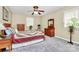 This bedroom features a bed, two dressers, and neutral colored walls at 7020 Leesburg Rd, Charlotte, NC 28215