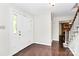 Inviting foyer with hardwood floors and bright white walls, offering a warm welcome at 7020 Leesburg Rd, Charlotte, NC 28215