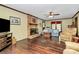 This living room features a brick fireplace, wood floors, and comfortable seating at 7020 Leesburg Rd, Charlotte, NC 28215