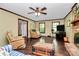 This expansive living room features wood floors, a ceiling fan, and comfortable seating at 7020 Leesburg Rd, Charlotte, NC 28215