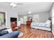 This studio apartment features a bed, television, and kitchenette at 7020 Leesburg Rd, Charlotte, NC 28215