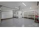 Bright, clean garage with epoxy flooring and plenty of space for parking and storage at 7067 Rocky Falls Rd, Charlotte, NC 28211