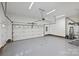 Spacious two-car garage with epoxy floors, a side entrance, and an automatic door opener at 7067 Rocky Falls Rd, Charlotte, NC 28211