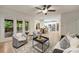 Spacious living room with an open floor plan, leading to a dining area and kitchen at 7067 Rocky Falls Rd, Charlotte, NC 28211