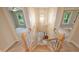 View of a carpeted staircase with a wooden banister, leading to the front entrance with natural light at 7067 Rocky Falls Rd, Charlotte, NC 28211