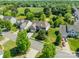 Aerial view of a beautiful home showcasing its well-manicured lawn and mature landscaping in a serene neighborhood at 709 Circle Trace Rd, Monroe, NC 28110