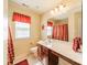 Bathroom with a long vanity, large mirror and red accents at 709 Circle Trace Rd, Monroe, NC 28110