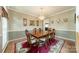 Elegant dining room with a chandelier, wood table with seating for six, and warm neutral tones at 709 Circle Trace Rd, Monroe, NC 28110