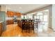Spacious kitchen with stainless steel appliances, wooden cabinets, island with seating, and adjacent dining area at 709 Circle Trace Rd, Monroe, NC 28110