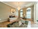 Sitting room features natural light, hardwood floors, neutral paint, and ornate decor at 709 Circle Trace Rd, Monroe, NC 28110