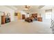 Spacious primary suite featuring a fireplace, tray ceiling with fan, and natural light at 709 Circle Trace Rd, Monroe, NC 28110