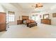 Large primary suite with a tray ceiling, carpeted floor, and plenty of natural light at 709 Circle Trace Rd, Monroe, NC 28110