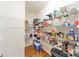 Walk-in pantry equipped with wire shelving providing lots of storage space for all your kitchen essentials at 709 Circle Trace Rd, Monroe, NC 28110