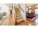 Inviting staircase with carpeted steps and a beautiful dining room view at 709 Circle Trace Rd, Monroe, NC 28110