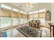 Sunroom boasting many windows dressed with woven shades providing lots of natural light at 709 Circle Trace Rd, Monroe, NC 28110