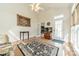 Bright sunroom with natural lighting, a ceiling fan, and access to the backyard at 709 Circle Trace Rd, Monroe, NC 28110