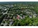 Aerial view of the property located near Carmel Country Club, showcasing the home's setting in a lush, green neighborhood at 7409 Stonecroft Park Dr, Charlotte, NC 28226