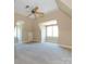 Large, bright bedroom with carpet, ceiling fan and unique arched windows at 7409 Stonecroft Park Dr, Charlotte, NC 28226