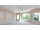 Spacious bedroom with neutral carpet, double doors and large windows offering natural light at 7409 Stonecroft Park Dr, Charlotte, NC 28226
