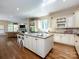 Gourmet kitchen with large island, granite countertops, and modern appliances at 7409 Stonecroft Park Dr, Charlotte, NC 28226