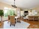Bright and open living area with hardwood floors and a dining table at 7409 Stonecroft Park Dr, Charlotte, NC 28226