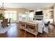 Open-concept living space with hardwood floors, fireplace, and natural light at 7409 Stonecroft Park Dr, Charlotte, NC 28226