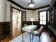 Stylish home office featuring built-ins, sleek desk with gold accents, and a comfortable chair at 7409 Stonecroft Park Dr, Charlotte, NC 28226