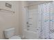 Bathroom featuring a shower and tub combination with a fish-themed curtain at 7693 Lazy Hollow Ln, Denver, NC 28037