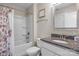Bathroom featuring shower and tub combination and granite countertop at 7693 Lazy Hollow Ln, Denver, NC 28037