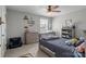 Bedroom with dresser, shelves, wood accents and neutral decor at 7693 Lazy Hollow Ln, Denver, NC 28037
