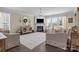 Bright living room featuring a fireplace, large windows, and neutral decor at 7693 Lazy Hollow Ln, Denver, NC 28037