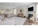 Bright living room featuring a fireplace, large windows, and neutral decor at 7693 Lazy Hollow Ln, Denver, NC 28037