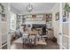 Spacious office with custom built-in shelving, a decorative light and French doors at 7693 Lazy Hollow Ln, Denver, NC 28037