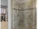 Tile shower featuring clear glass door and built-in niche at 7693 Lazy Hollow Ln, Denver, NC 28037