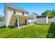 The backyard has a covered patio with furniture, a storage shed, and a well-maintained lawn at 773 Sir Raleigh Dr, Concord, NC 28025