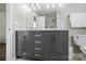 Bathroom with a double sink vanity, marble countertop, and sleek, modern finishes at 773 Sir Raleigh Dr, Concord, NC 28025