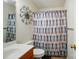 Cozy bathroom with colorful shower curtain, sink, toilet and decorative wall art at 773 Sir Raleigh Dr, Concord, NC 28025