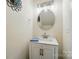Charming bathroom vanity with modern lighting, stylish mirror, and a blue accent towel at 773 Sir Raleigh Dr, Concord, NC 28025