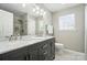Elegant bathroom with double vanity sinks, marble countertops, and stylish lighting fixtures at 773 Sir Raleigh Dr, Concord, NC 28025