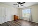 Bright bedroom with a large window, ceiling fan, and a closet providing ample storage space at 773 Sir Raleigh Dr, Concord, NC 28025