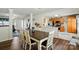 Open-concept dining area next to the kitchen featuring an inviting table set for six and a view to the living room at 773 Sir Raleigh Dr, Concord, NC 28025