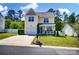 Lovely two-story home with garage, landscaping and cozy front porch seating area at 773 Sir Raleigh Dr, Concord, NC 28025