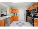 View of kitchen featuring oak cabinetry, stainless steel appliances, and durable granite countertops at 773 Sir Raleigh Dr, Concord, NC 28025