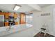 Bright kitchen area with granite countertops, wood cabinets, backsplash, and a sunny window with valance at 773 Sir Raleigh Dr, Concord, NC 28025