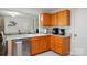Kitchen showcasing oak cabinets, granite countertops, stainless steel appliances, and a stainless sink at 773 Sir Raleigh Dr, Concord, NC 28025